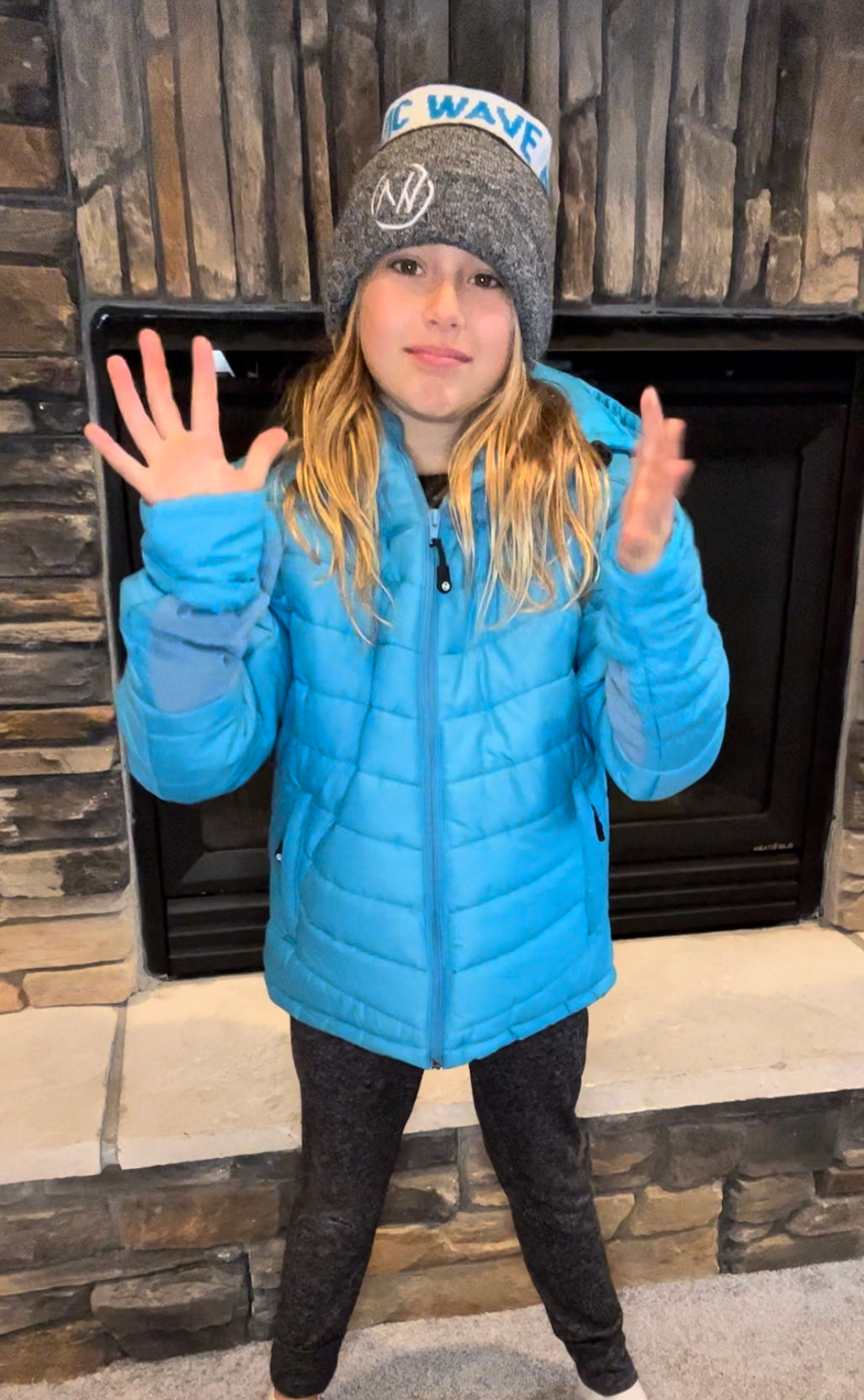 Load video: A video showing how to use the winter coat to go from hands-free to using the mittens and then back to hands-free.